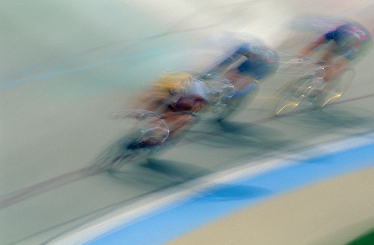 Cyclists racing in a velodrome