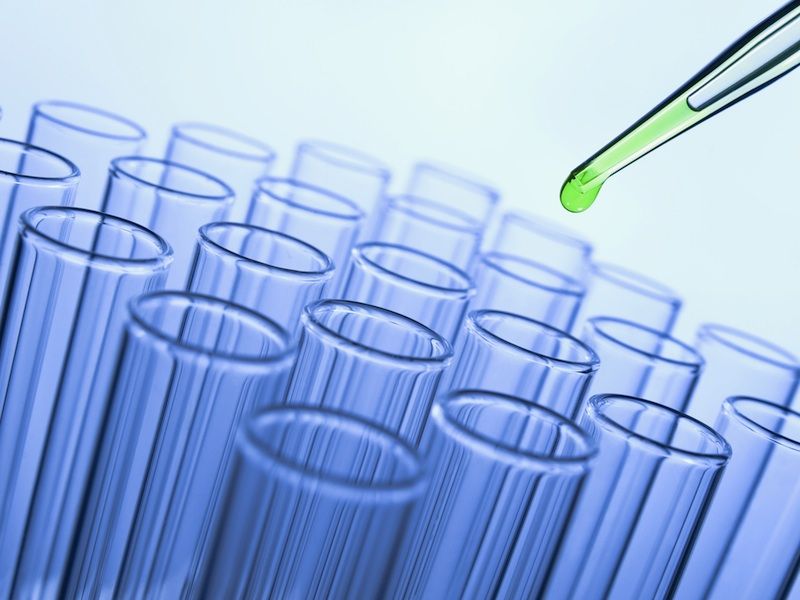 Chemistry scene of test tubes and pipette.