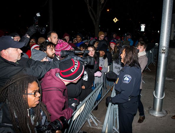 Demonstrators and media outside a Minneapolis police station