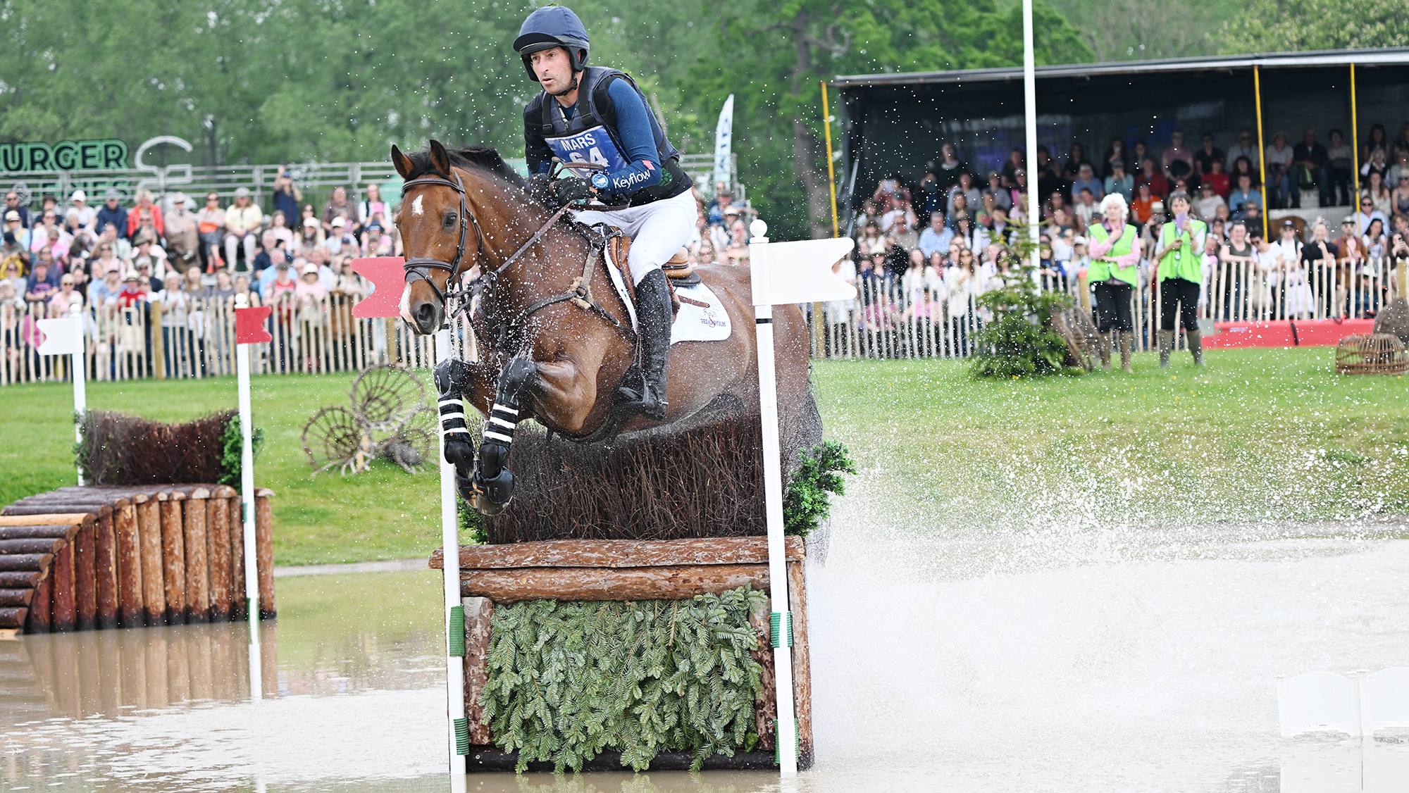 Tim Price and Falco jump a fence in The Lake at Badminton 2026.