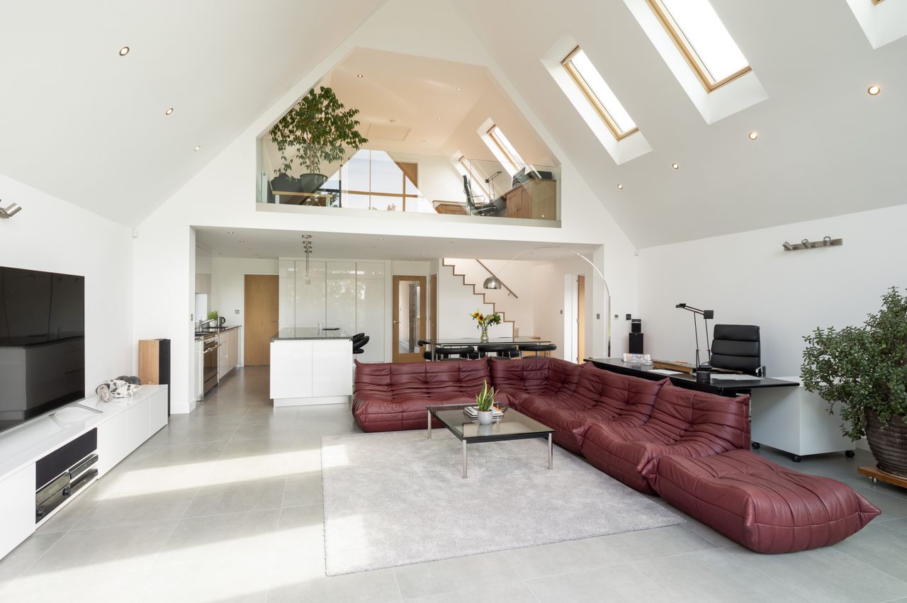 Ceramic tiles have been laid over underfloor heating throughout the ground floor in order to tie it all together visually.