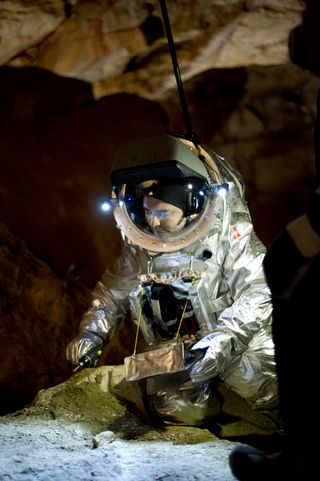The Aouda.X spacesuit tests were part of a 5-day Mars mission analog field test performed at Mammoth Cave in the Giant Ice Caves of Dachstein, Austria, by the Austrian Space Forum and international research partners in April-May 2012. Suit tester Daniel Schildhammer takes samples at the Dachstein giant ice cave.