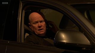 Phil Mitchell in the car on the phone