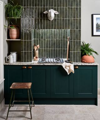 Gark green kitchen with shaker cabinets