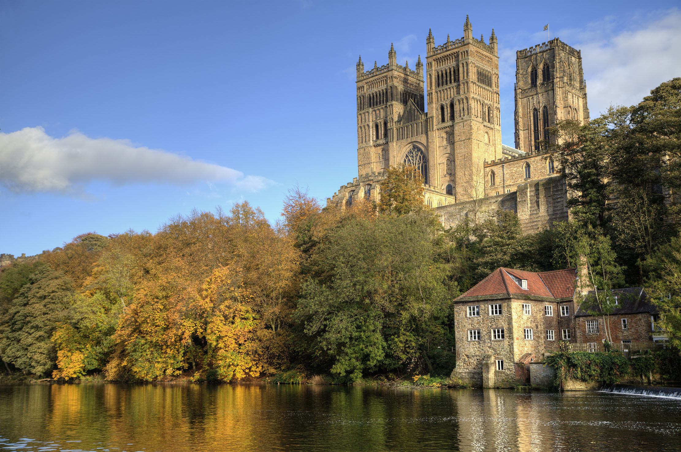 Durham Cathedral atop the hill, the Old Fulling Mill below, both looking over the River Wear.