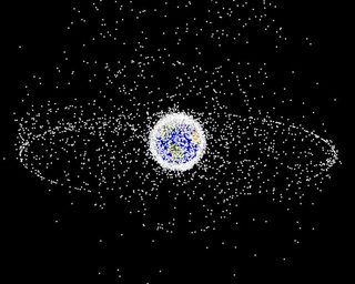 A computer-generated image of objects in Earth orbit that are currently being tracked. Approximately 95 percent of the objects in this illustration are orbital debris – not functional satellites. The dots represent the current location of each item. The orbital debris dots are scaled according to the image size of the graphic to optimize their visibility and are not scaled to Earth.