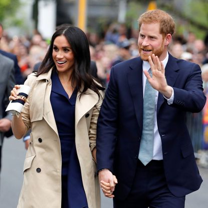 melbourne, australia october 18 prince harry, duke of sussex and meghan, duchess of sussex wave to the crowd as they arrive at the royal botanic gardens on october 18, 2018 in melbourne, australia the duke and duchess of sussex are on their official 16 day autumn tour visiting cities in australia, fiji, tonga and new zealand photo by phil noble poolgetty images