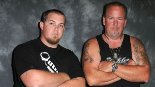 Darrell and Brandon Sheets stand together in black tees at a 2012 Storage Wars event. 