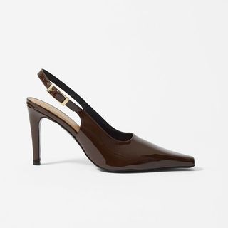 Flat lay image of brown leather slingbacks