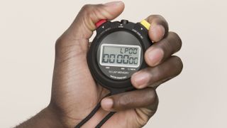 Person holding a stopwatch