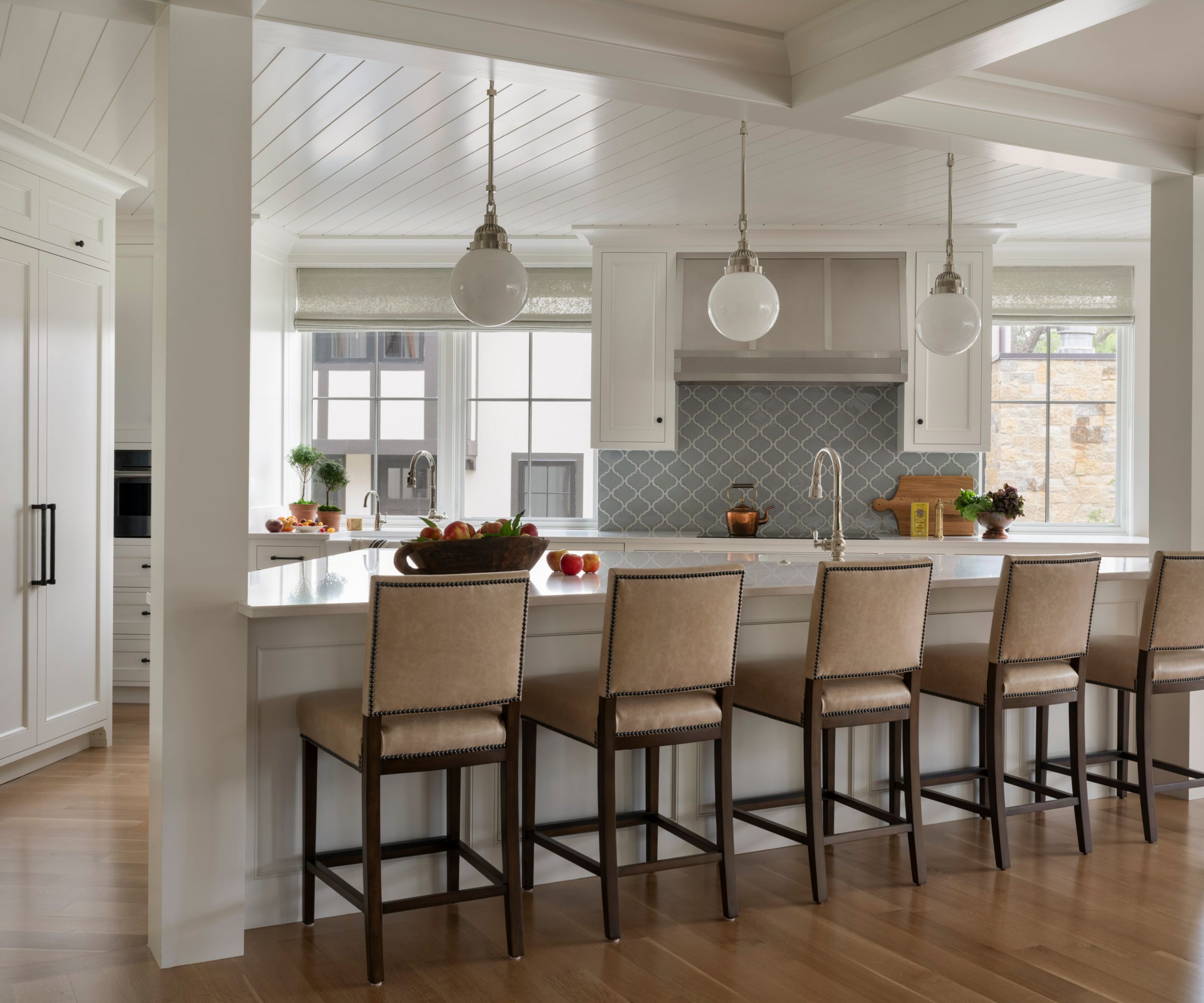 white kitchen with wedge shaped island