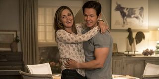 Instant Family Rose Byrne Mark Wahlberg in a laughing embrace