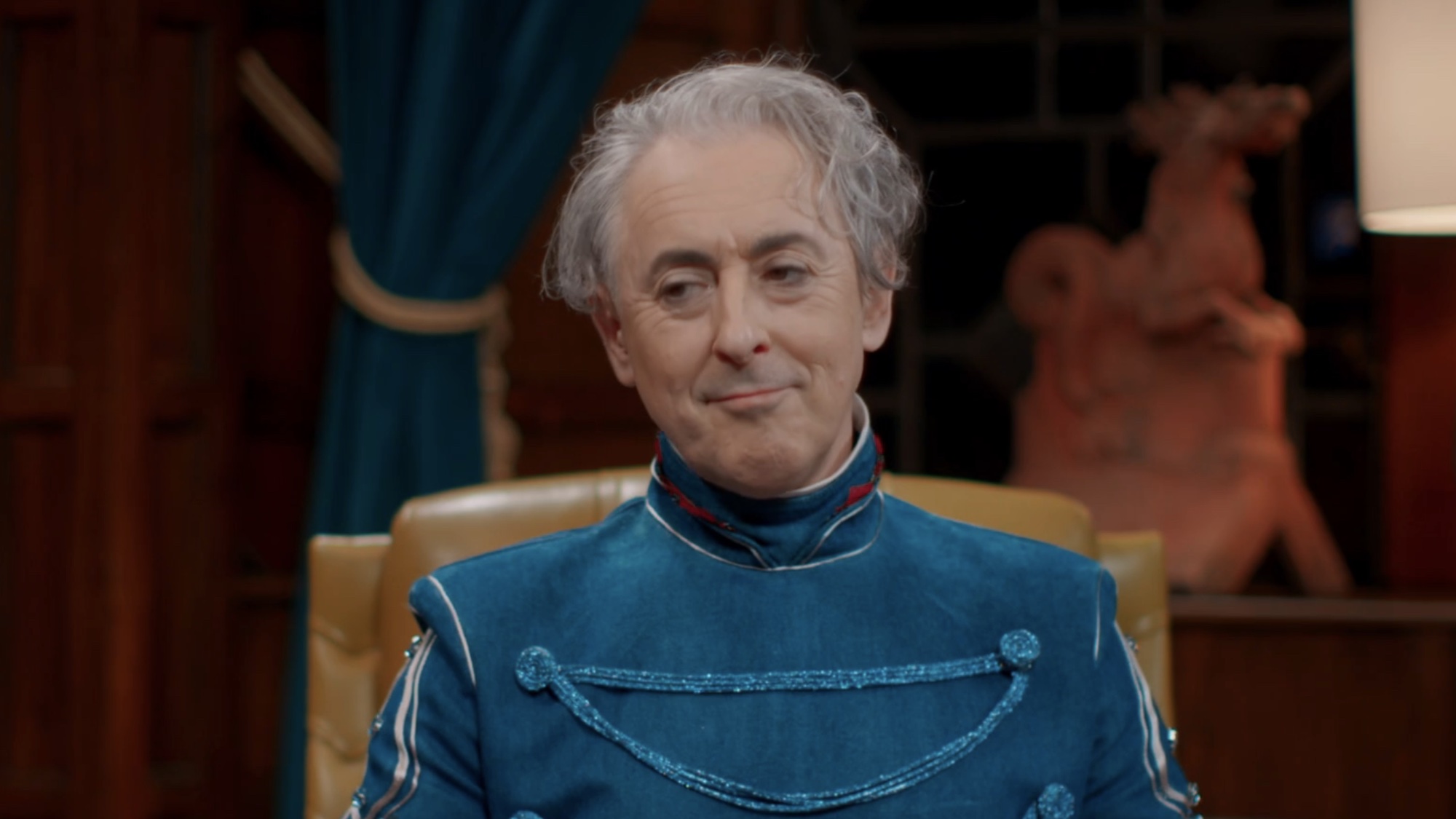 Alan Cumming smiling in The Triaitors: New Blood. 