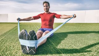 a man strength training with a resistance band