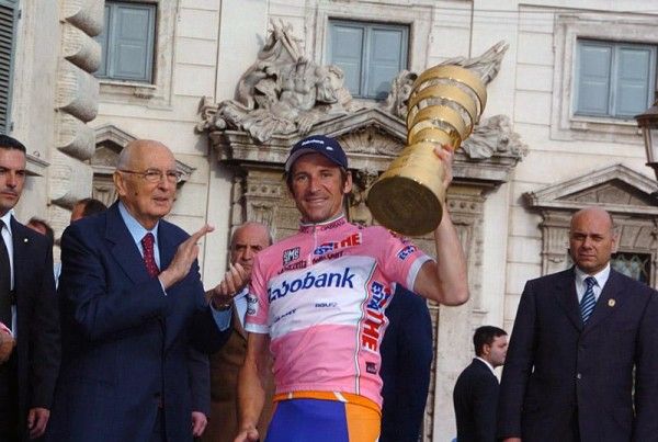 Denis Menchov (Rabobank) raises the winner's trophy.