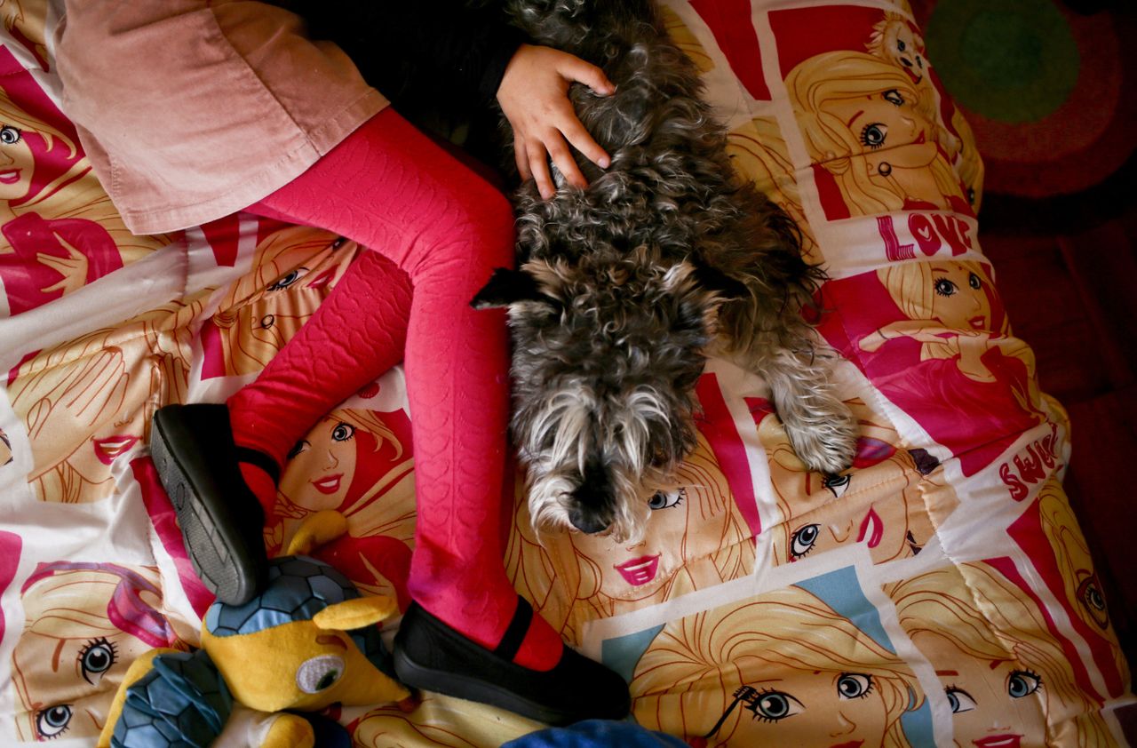 A transgender girl in her bed in Santiago, Chile. 