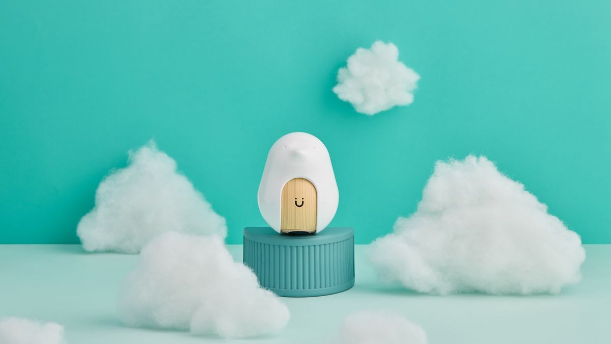 The CuboAi Smart Baby Monitor 3 on a blue background with clouds