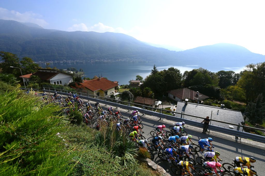 OMEGNA ITALY OCTOBER 06 A general view of the peloton passing close to the Lake Orta during the 106th Gran Piemonte 2022 a 198km one day race from Omegna to Beinasco GranPiemonte on October 06 2022 in Omegna Italy Photo by Tim de WaeleGetty Images