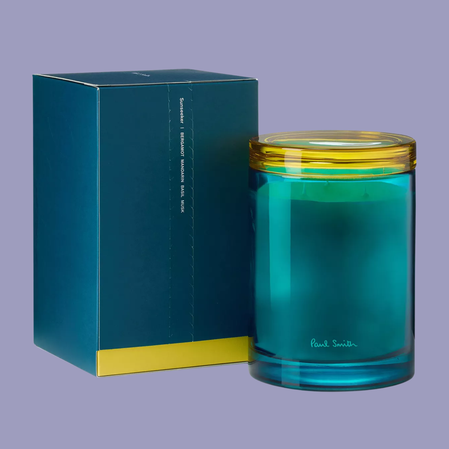 A blue candle with a yellow glass lid
