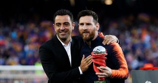 Xavi with Lionel Messi of FC Barcelona during the La Liga Santander match between FC Barcelona v Real Sociedad at the Camp Nou on May 20, 2018 in Barcelona Spain