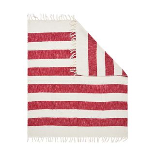 a red and white striped throw