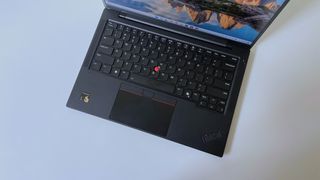 The keyboard deck on the Lenovo ThinkPad T14s Gen 6 seen from above on a white table