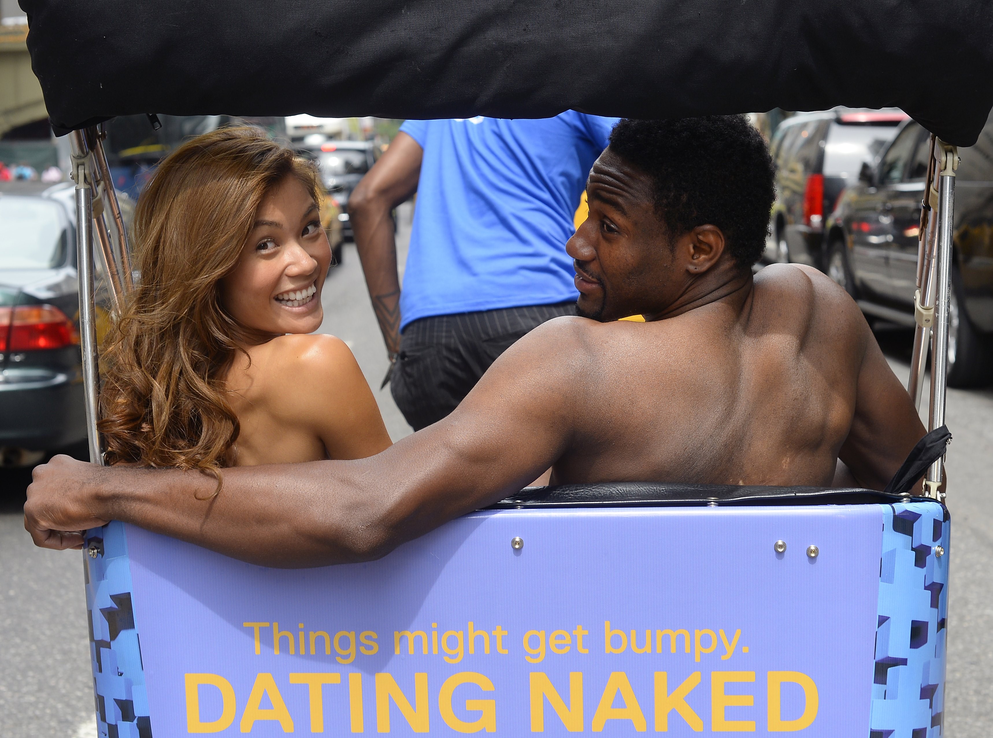 a naked woman and a naked man sitting in the back of a bike mobile in the tv show dating naked