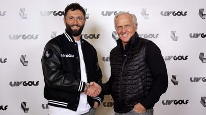Jon Rahm and Greg Norman shake hands at Rahm's LIV Golf unveiling
