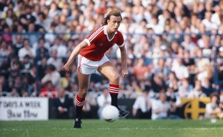 Sammy McIlroy of Manchester United in action during a Division One match against Tottenham Hotspur at White Hart Lane on September 6, 1980 in London, England.