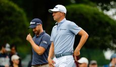 Wyndham Clark and Justin Thomas walk down the fairway at the Travelers Championship