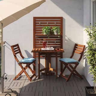 outdoor dining set on a balcony space