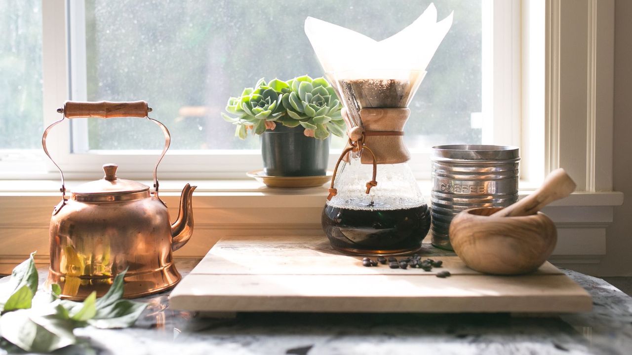 An example of how to make coffee without a grinder; grinding the beans with a mortar and pestle before adding to a pour over