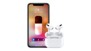 Apple AirPod Pro review: the true wireless earbuds photographed next to an Apple iPhone 11 phone
