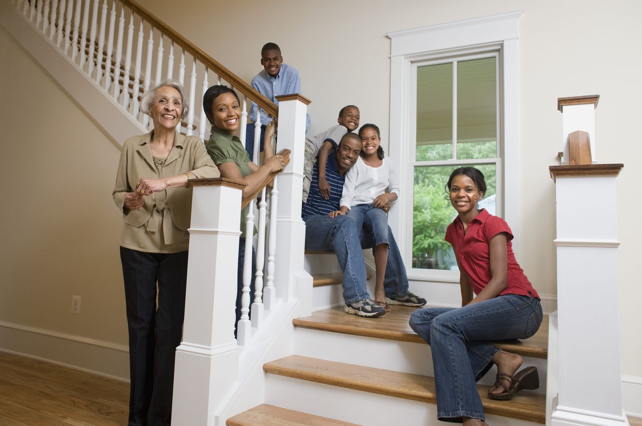 Family portrait on stairs in new home