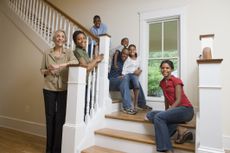 Family portrait on stairs in new home