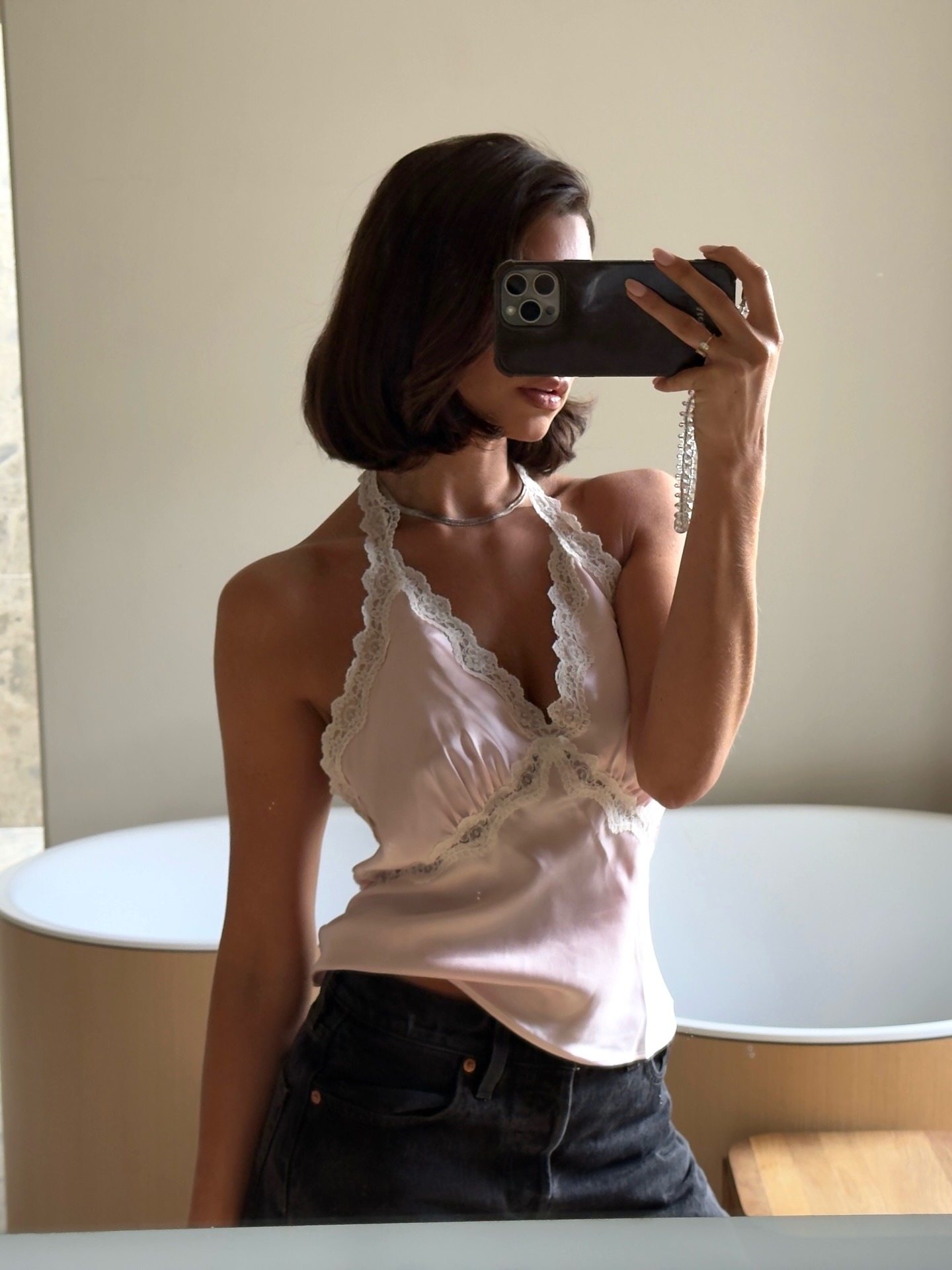 Woman in a lace-trim top