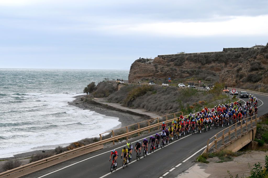 Peloton races by the Mediterranean sea