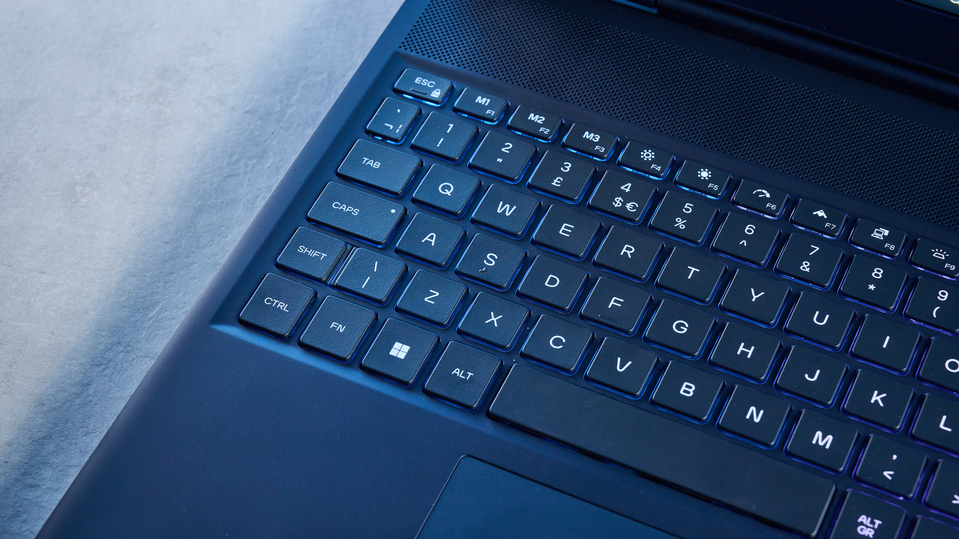 A blue Alienware 16X Aurora gaming laptop