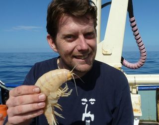 Scientist Alan Jamieson holds his unexpected find.