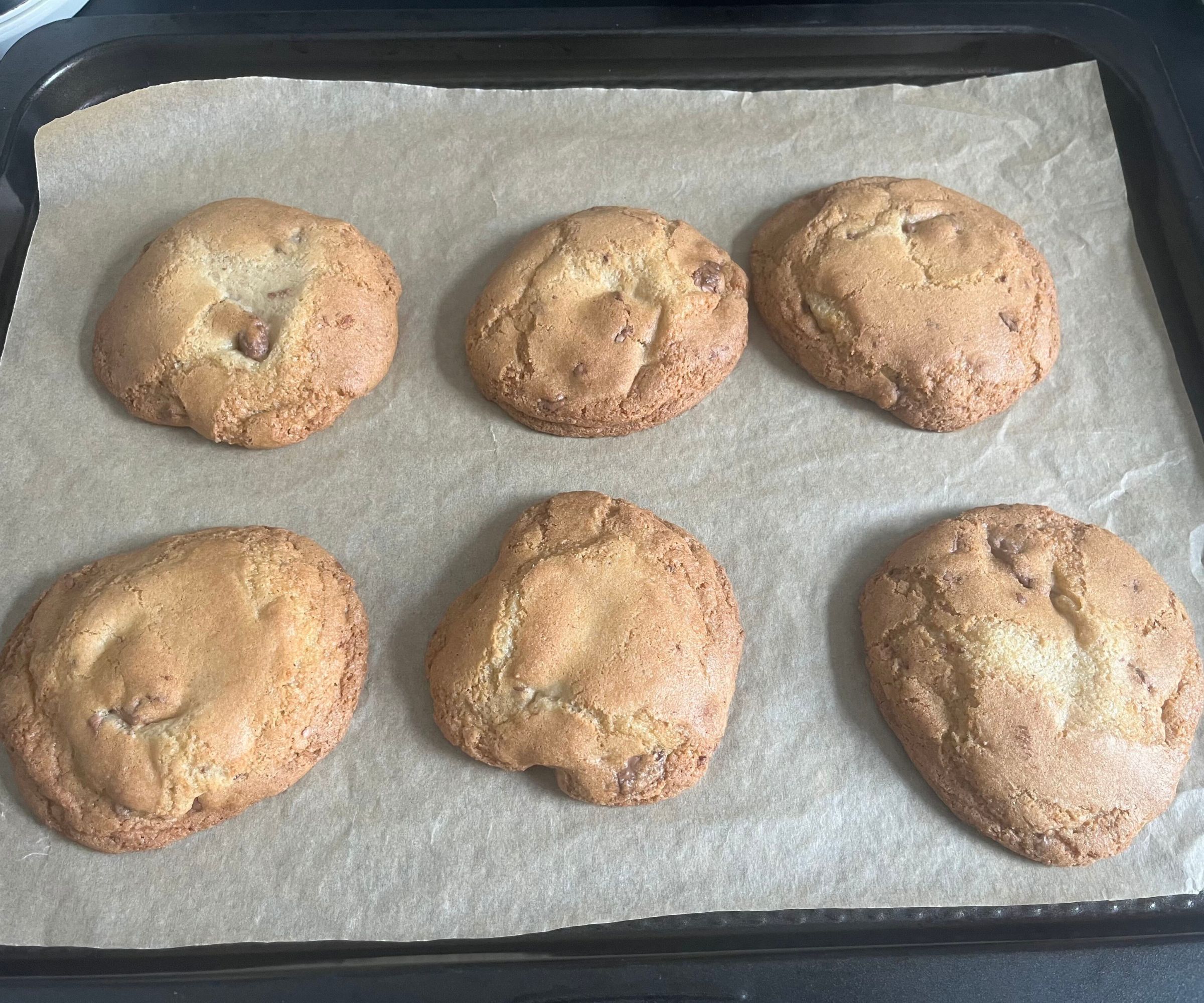 Lightly browned cookies on a baking sheet. 