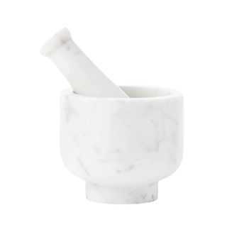 A kitchen pestle and mortar made of marble