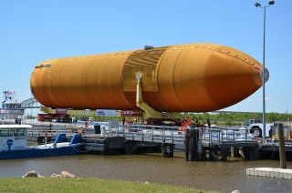 ET-94, the last of NASA's external tanks built to launch a space shuttle, was loaded onto a barge at the Michoud Assembly Facility in New Orleans on Sunday, April 10, 2016. The tank is destined for display with space shuttle Endeavour at the California Science Center.