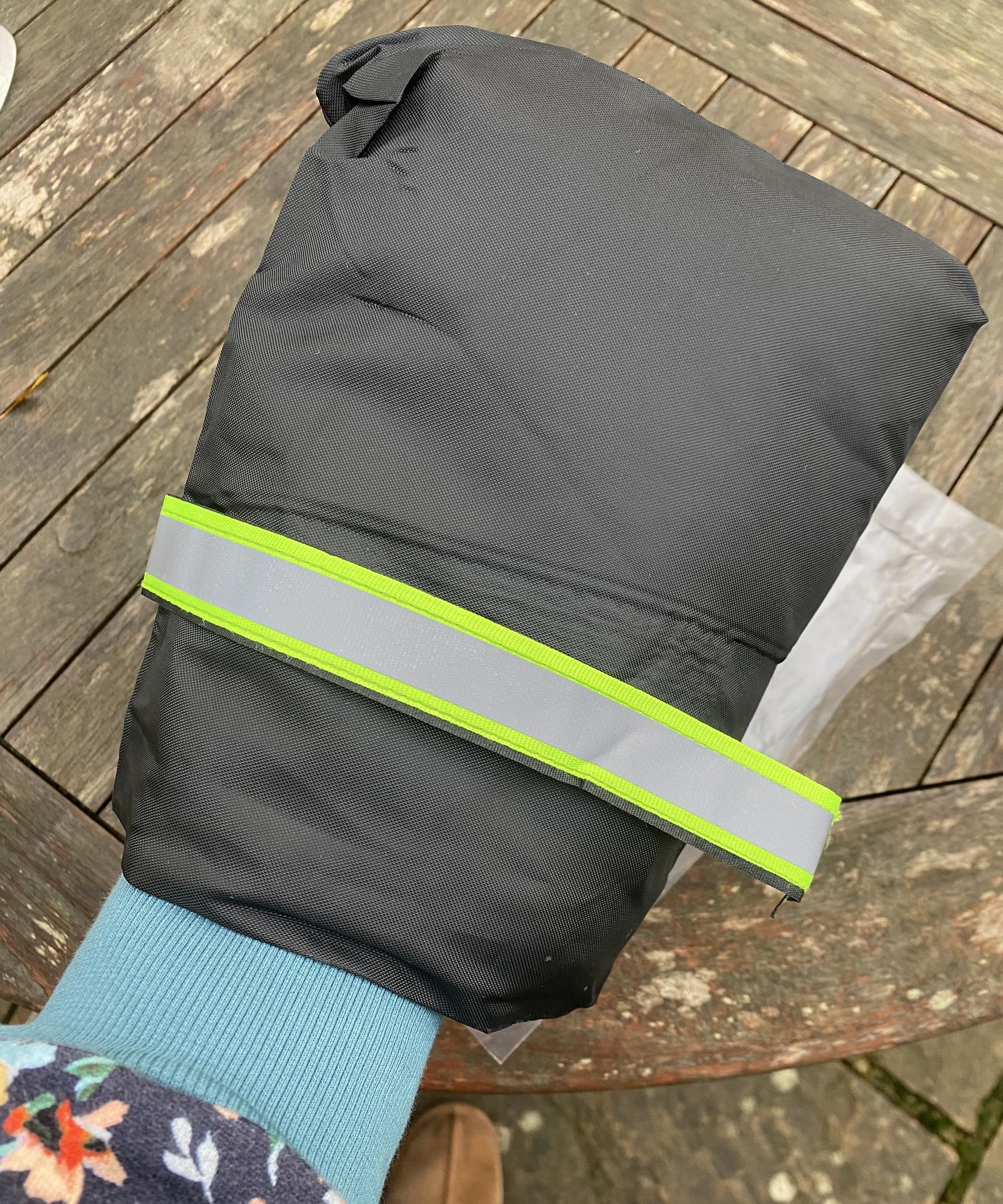 Wearing faucet cover on hand like a mitten