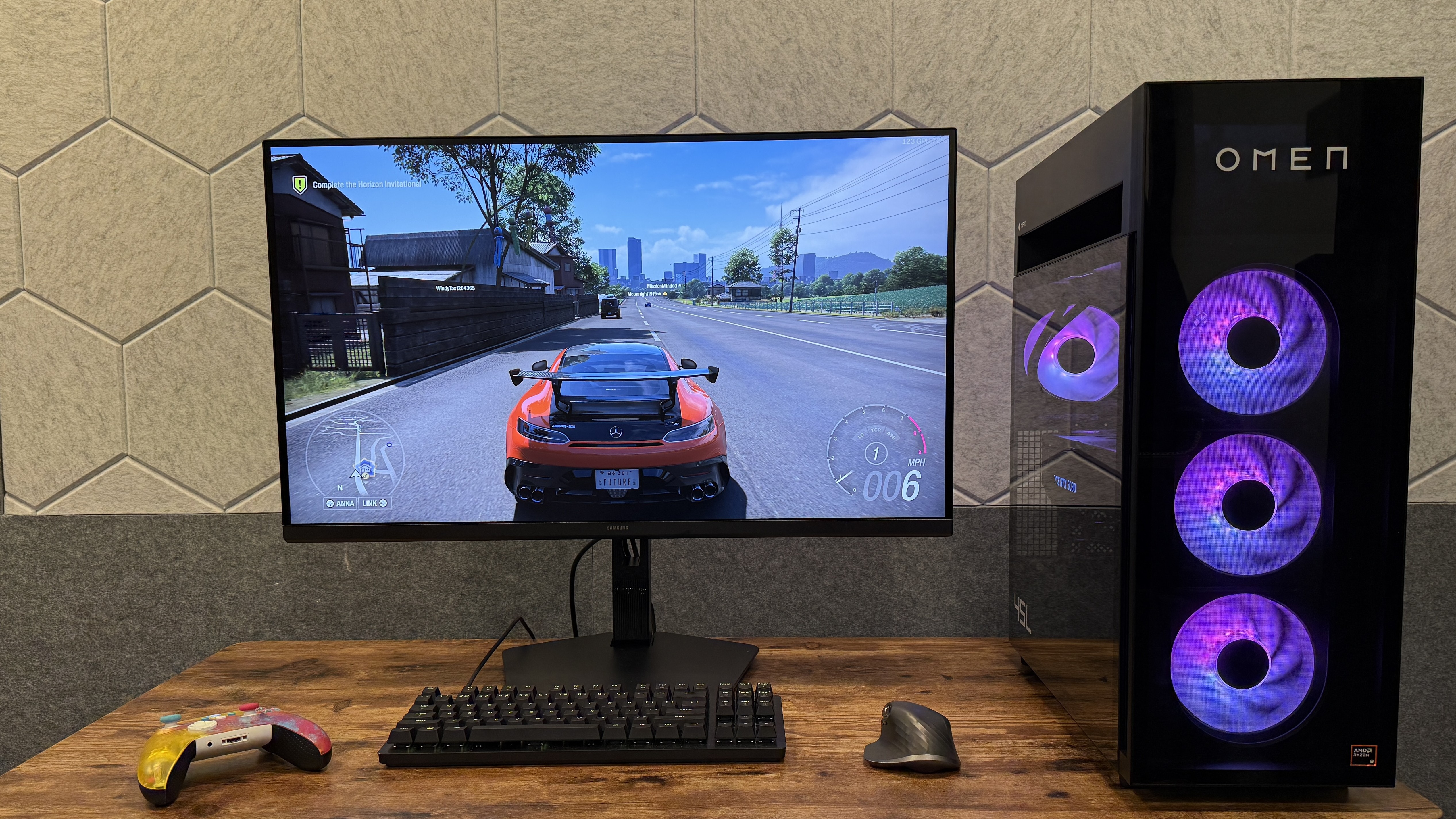 The HP Omen Max 45L gaming PC next to a monitor on a desk