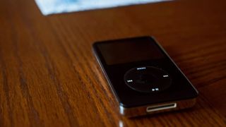 Black iPod Classic on a wooden table