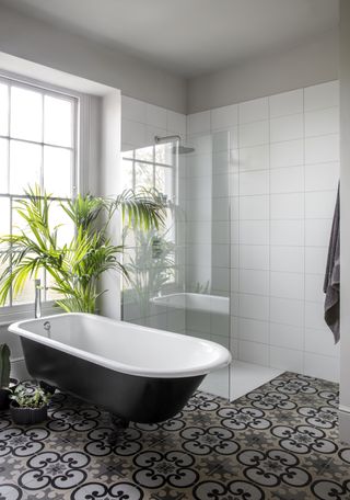 A bathroom with a separate shower and a separate bath area