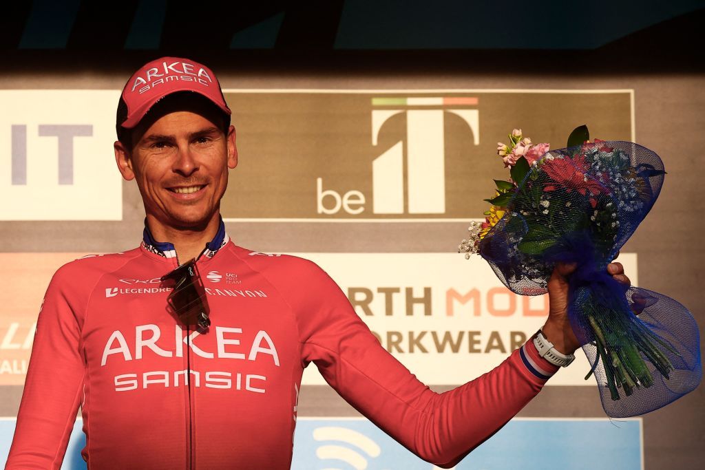 Team Arkea Samsics Warren Barguil of France celebrates on the podium after winning the 5th stage of the Tirreno Adriatico cycling race 155 km from Sefro to Fermo on March 11 2022 Photo by Luca Bettini AFP Photo by LUCA BETTINIAFP via Getty Images