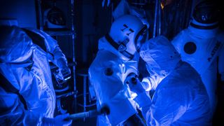 These are not astronauts readying for a space walk but technicians preparing to fuel the James Webb Space Telescope with toxic propellant.