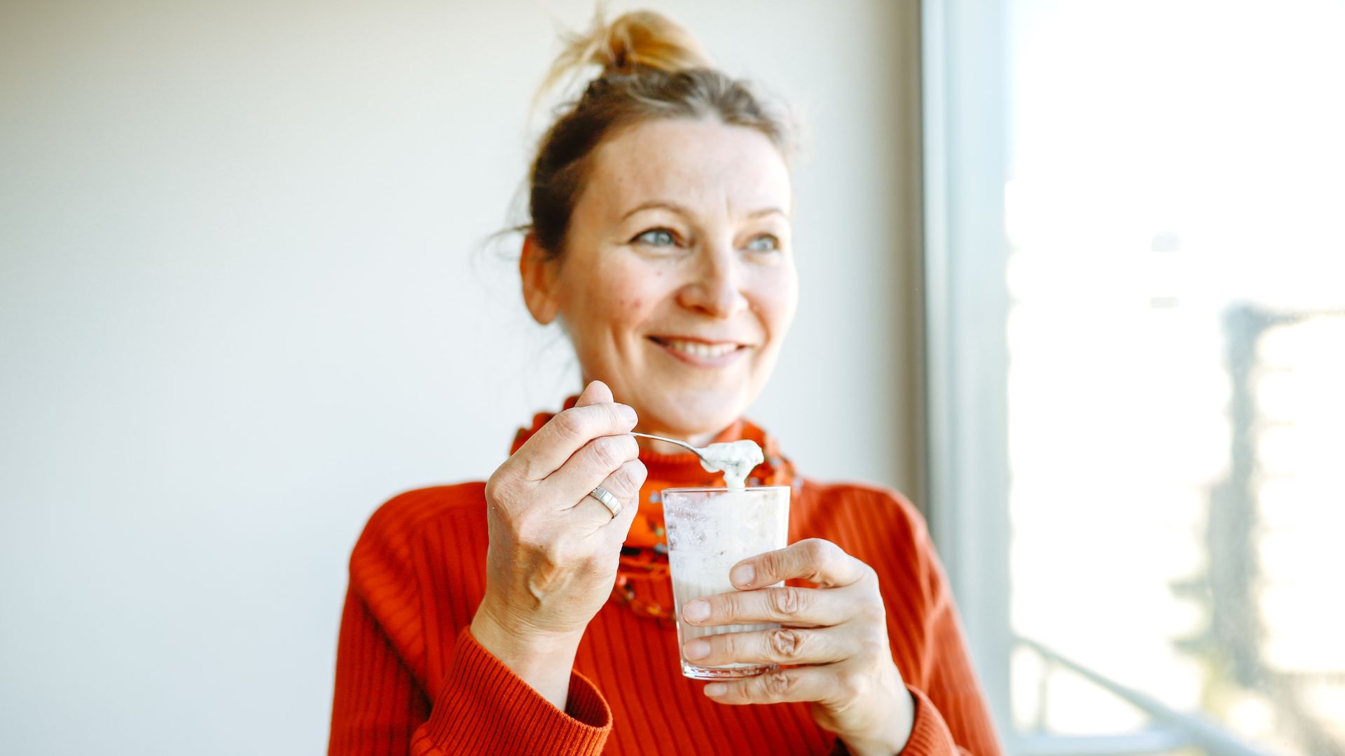 Woman eating from spoon