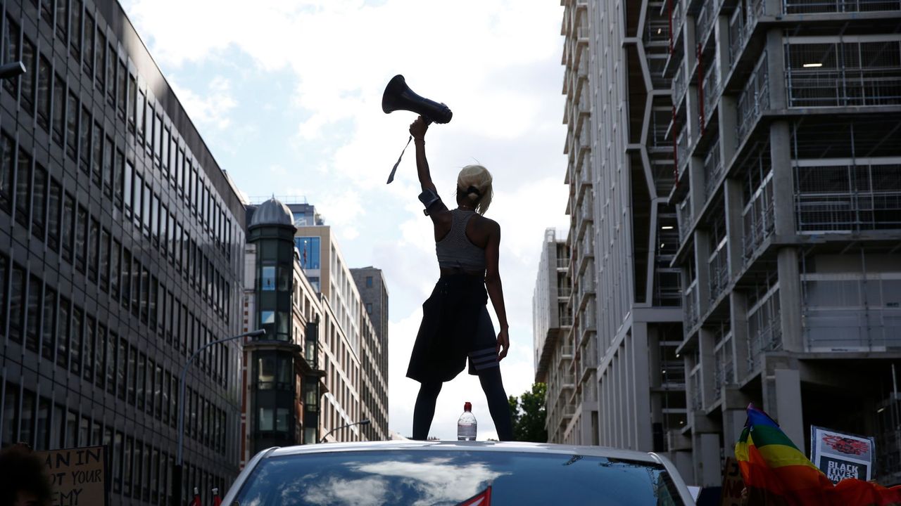 Activist Imarn Ayton holding a megaphone